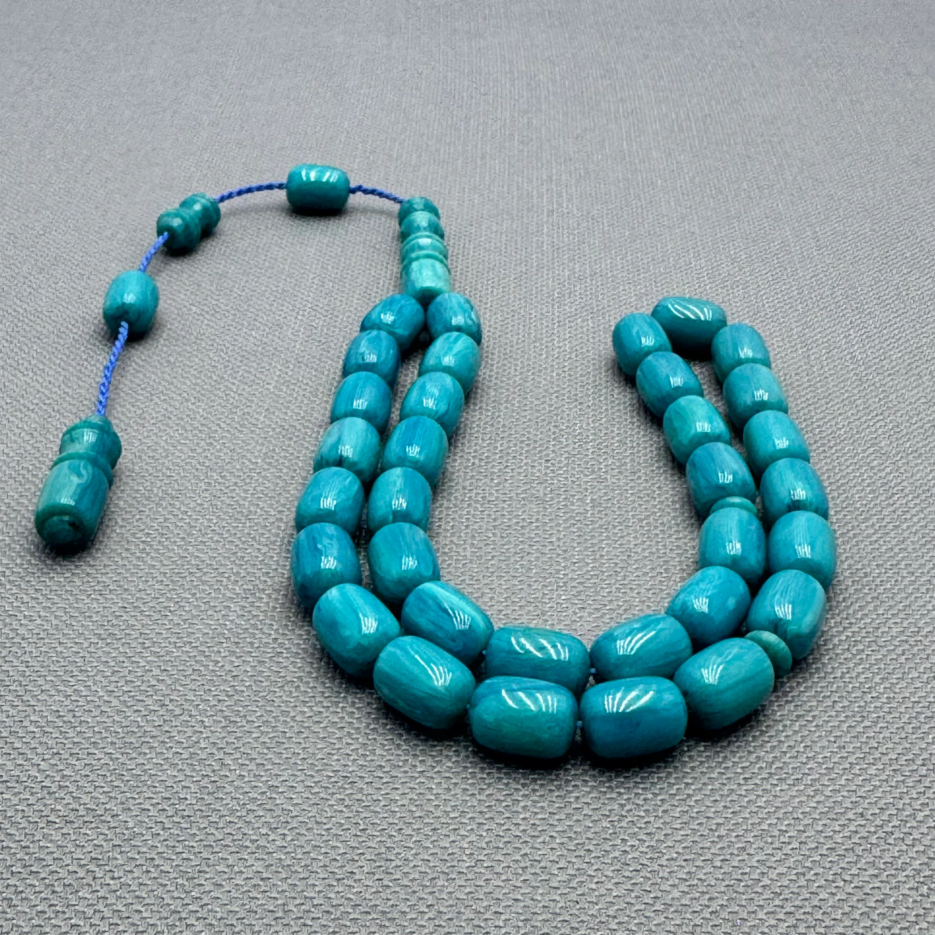 Usta İşçilikli Hareli Turkuaz Renk Dik Damarlı Kapsül Kesim Sıkma Kehribar Tespih